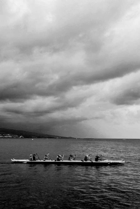 A group of people on a rowing boat